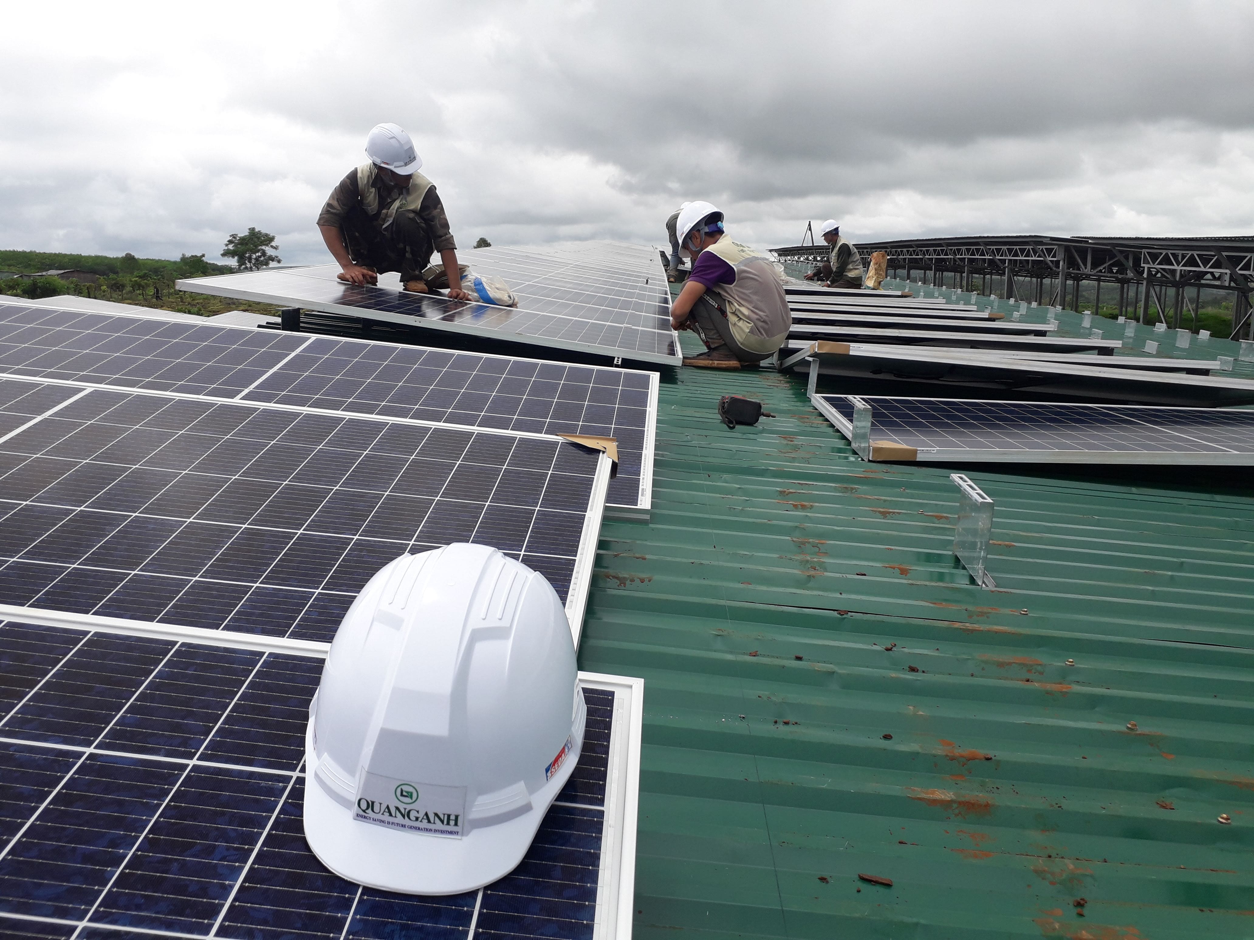 QuangAnhcons workers installing rooftop solar modules