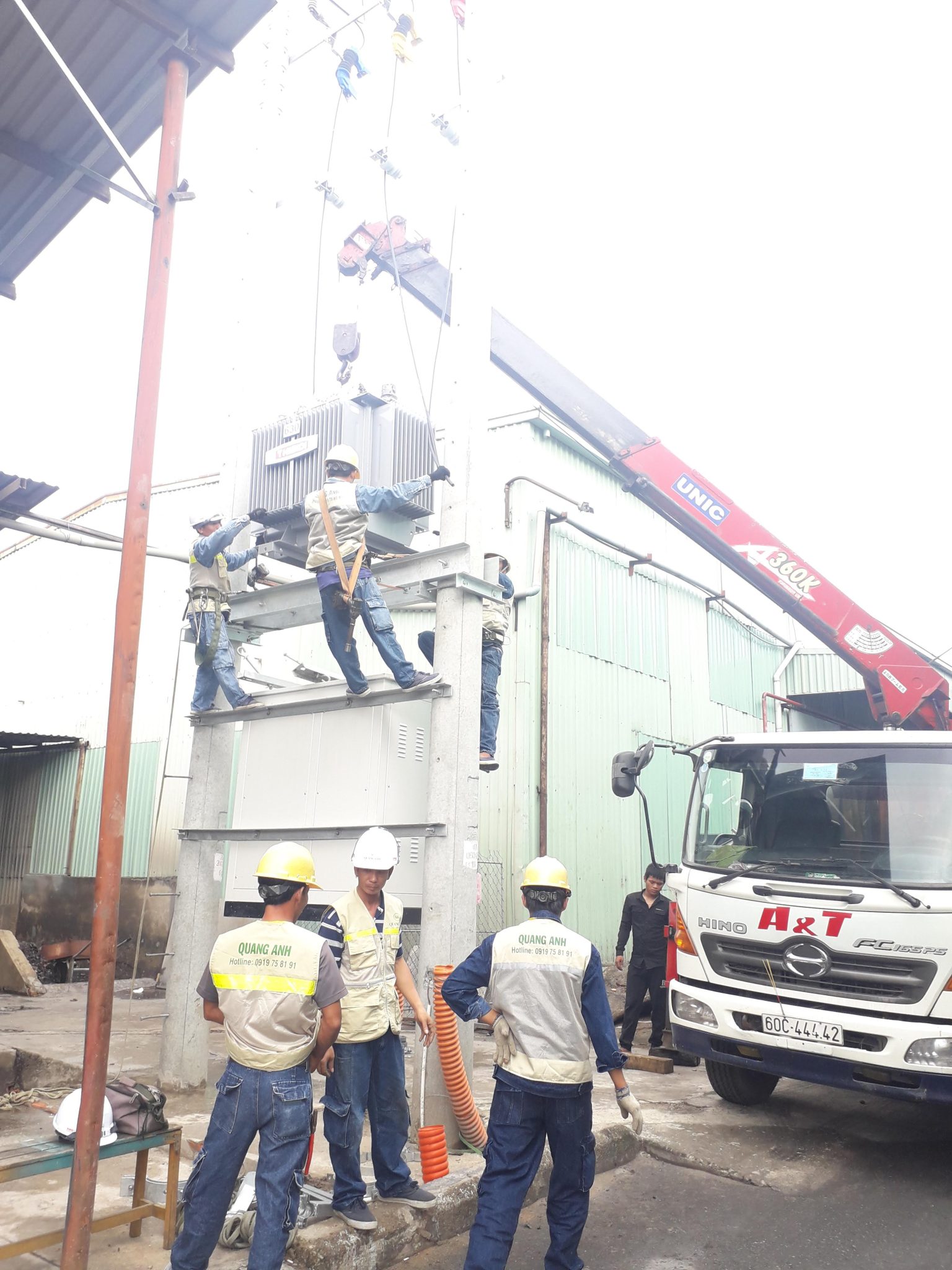 Experts inspecting the factory's electrical system