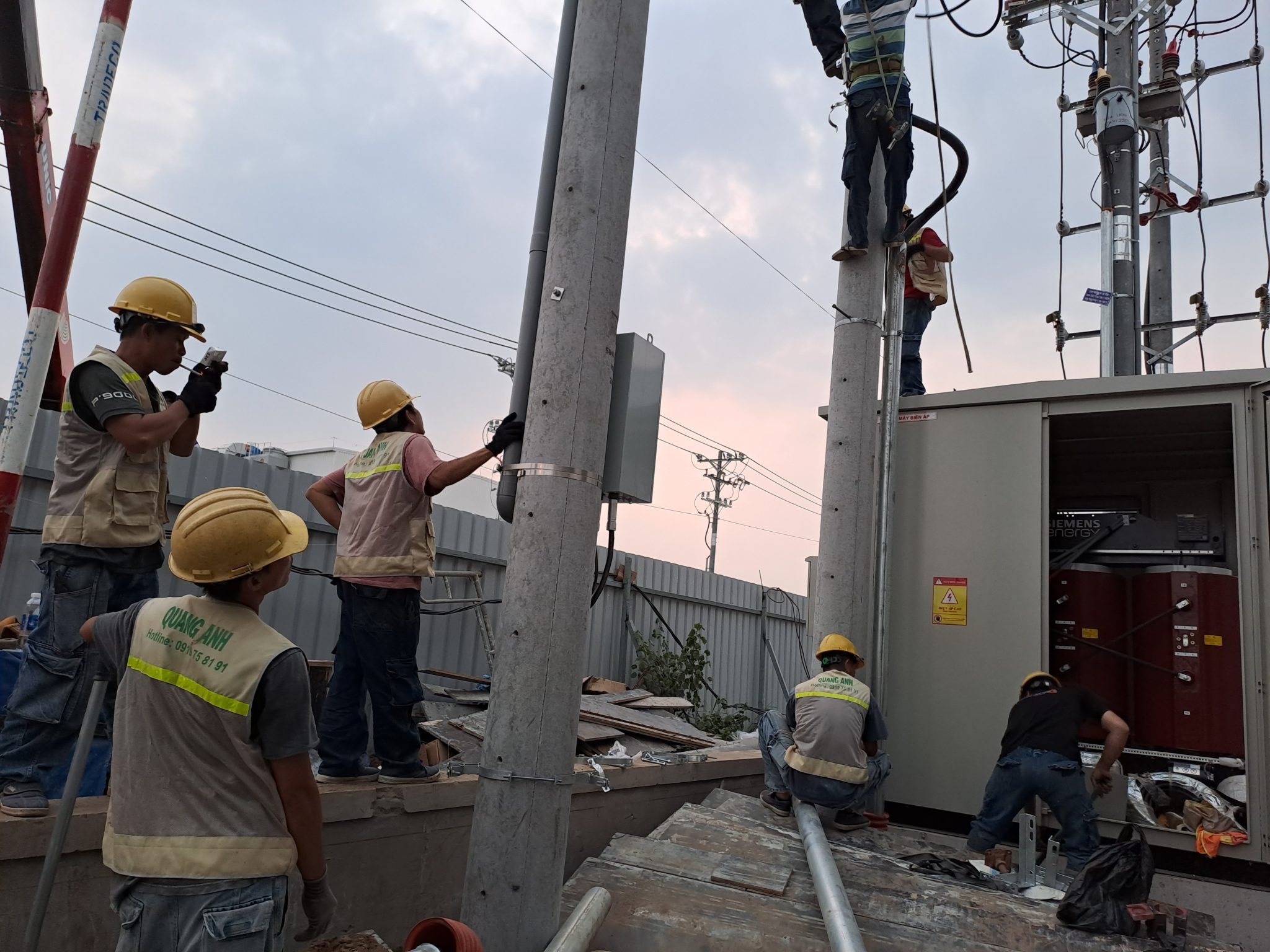 Industrial Electrical Installation Process. Engineer installing an industrial electrical system.