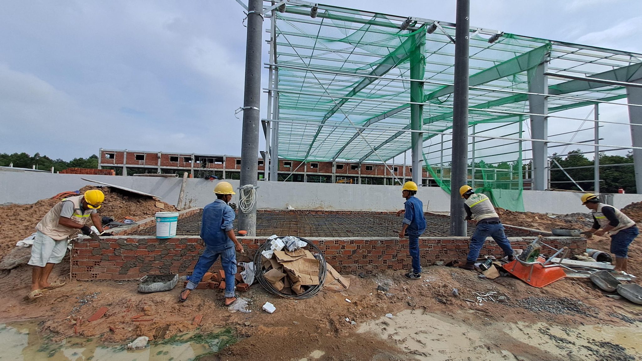 Determining Electrical Load Requirements Engineers calculating electrical load for factories