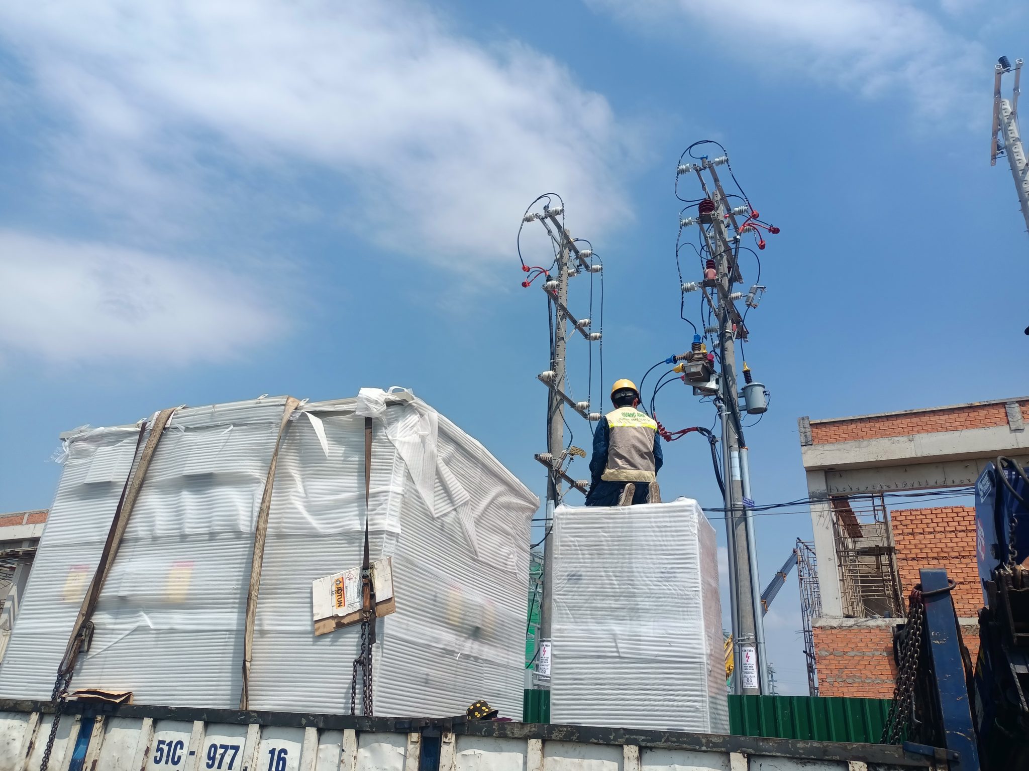 QuangAnhcons Expertise and Competitive Advantages Engineer installing electrical equipment