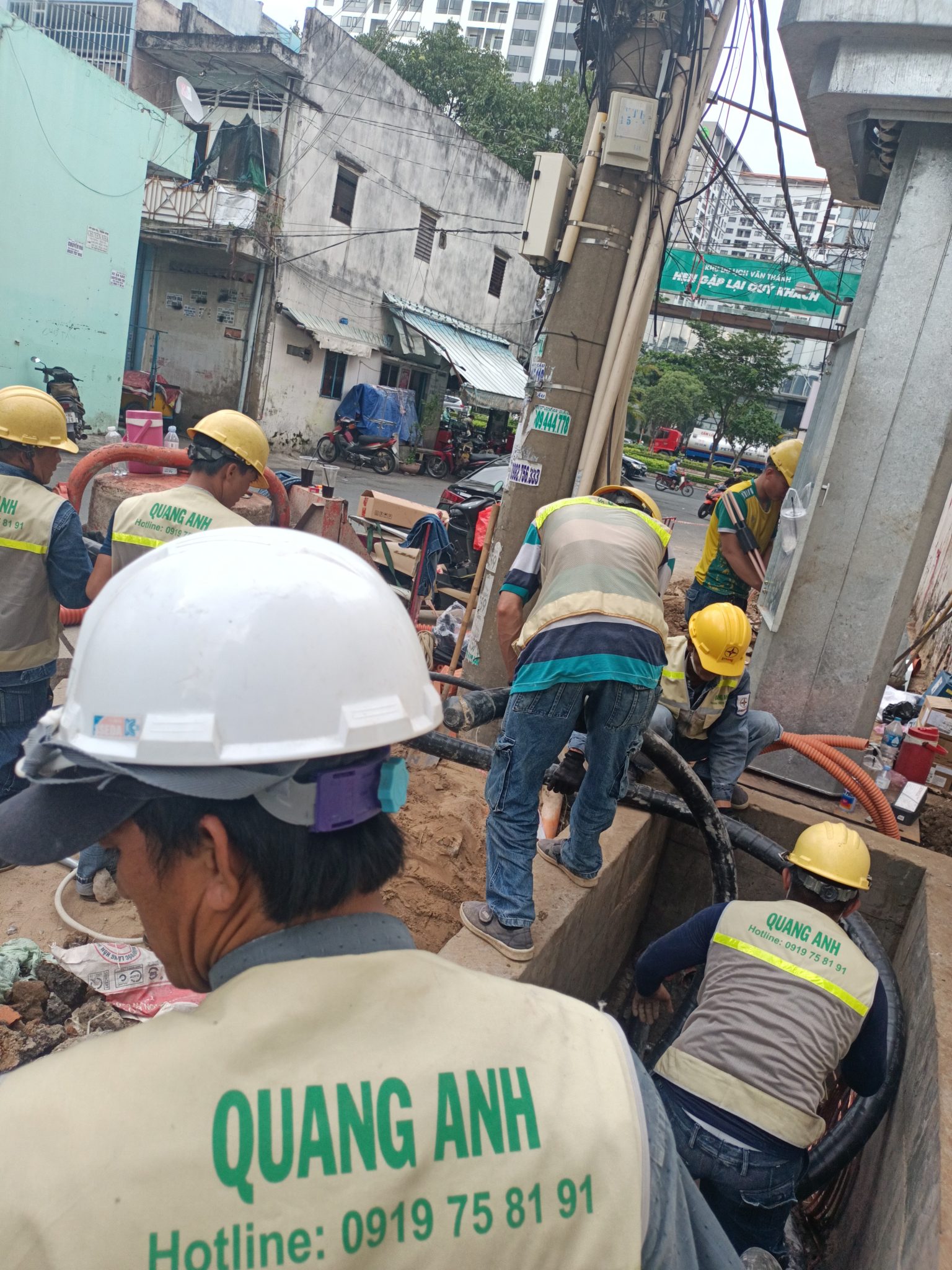 Industrial Electrical System Construction by QuangAnhcons QuangAnhcons engineers working on a complex electrical system.