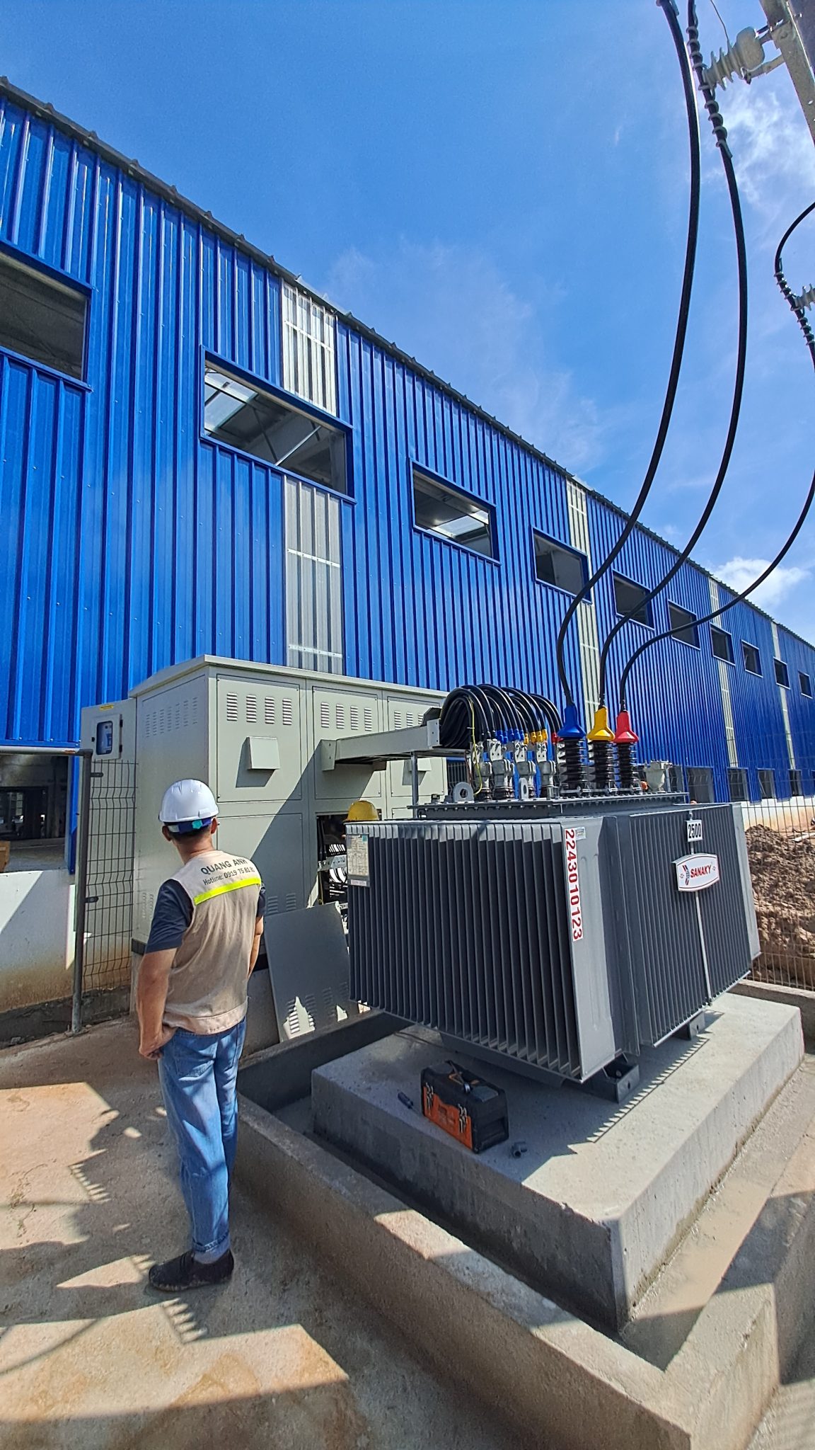 Engineer overseeing industrial electrical system.