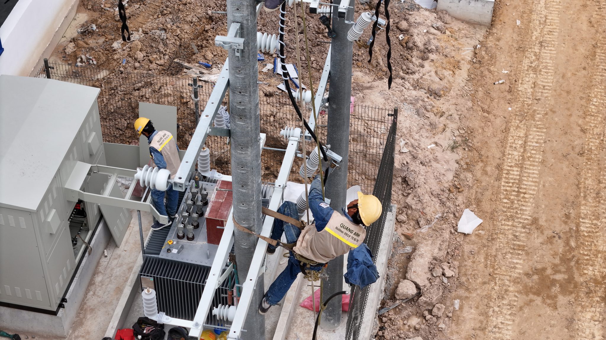 Installation of medium-voltage systems Workers installing medium-voltage electrical systems