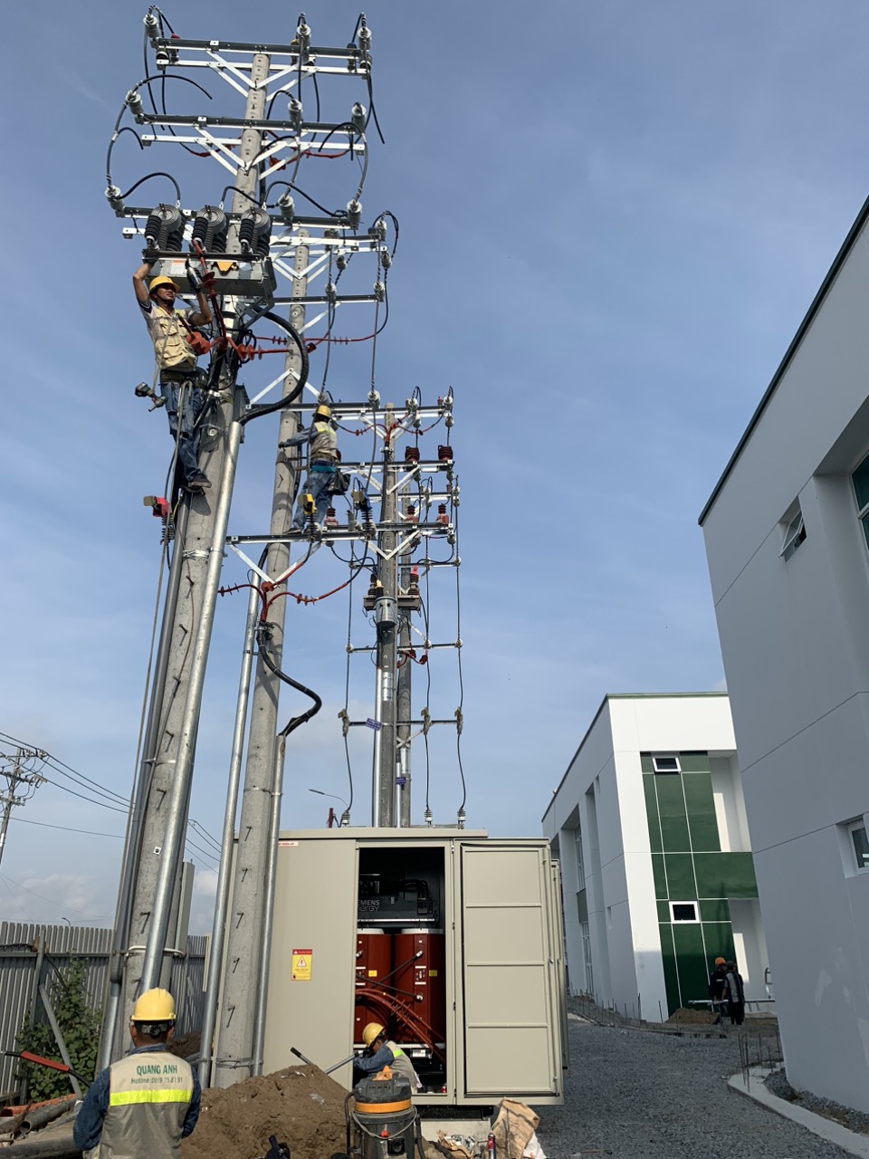 Incoming electrical supply works beside a factory building