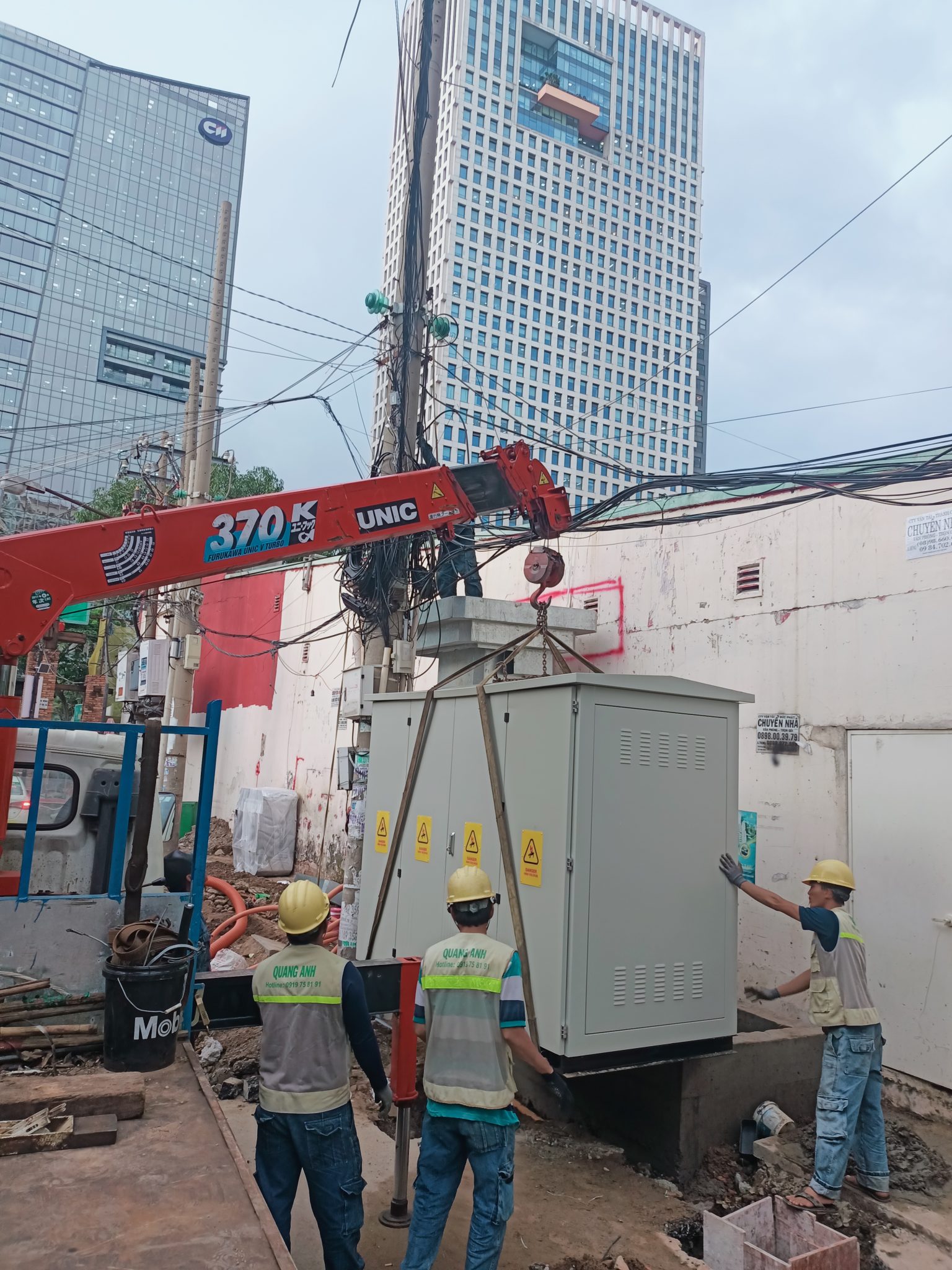 Engineer conducting maintenance on factory electrical system