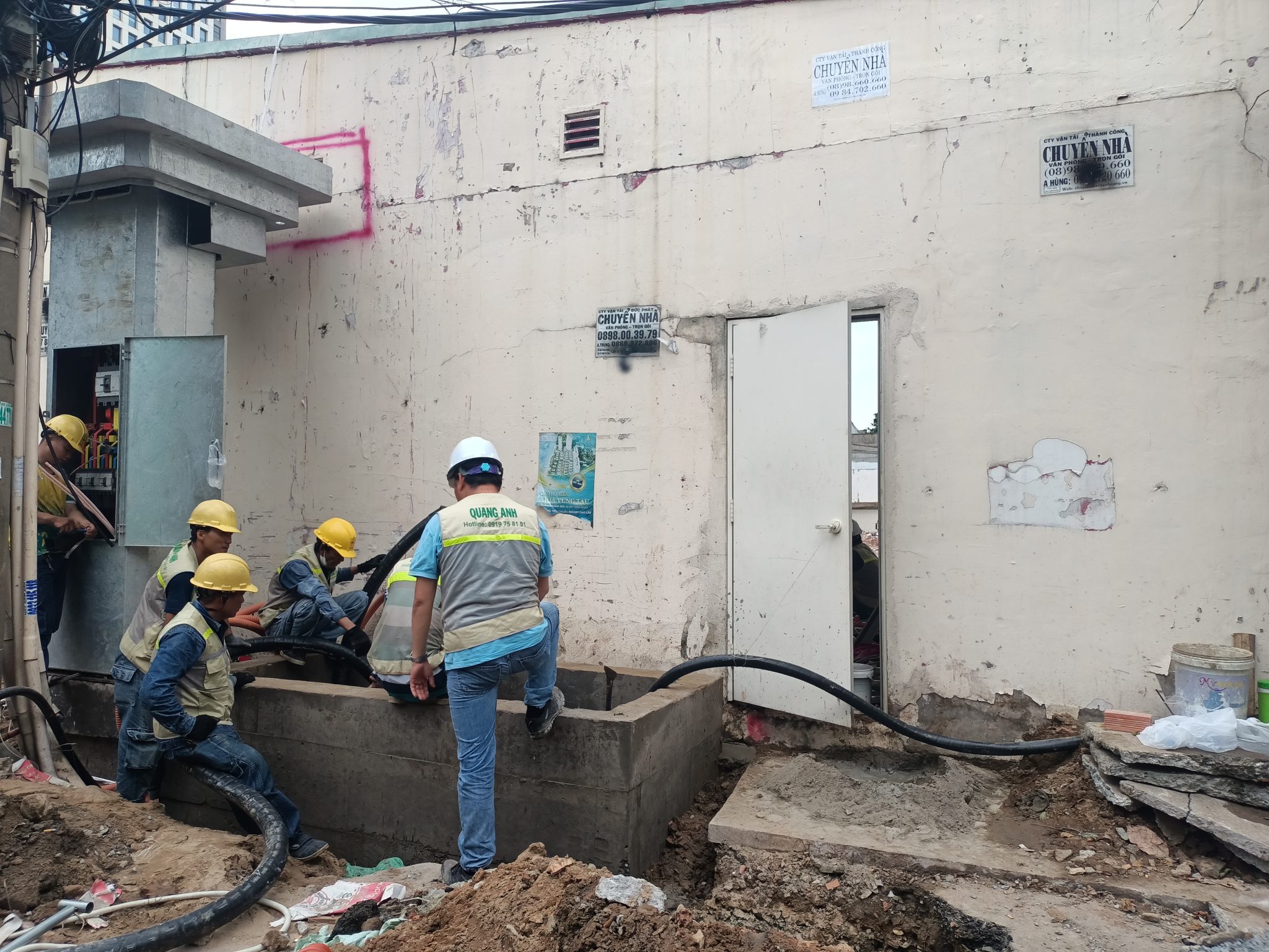 Maintenance work for EV charging stations Technicians working on charging stations.
