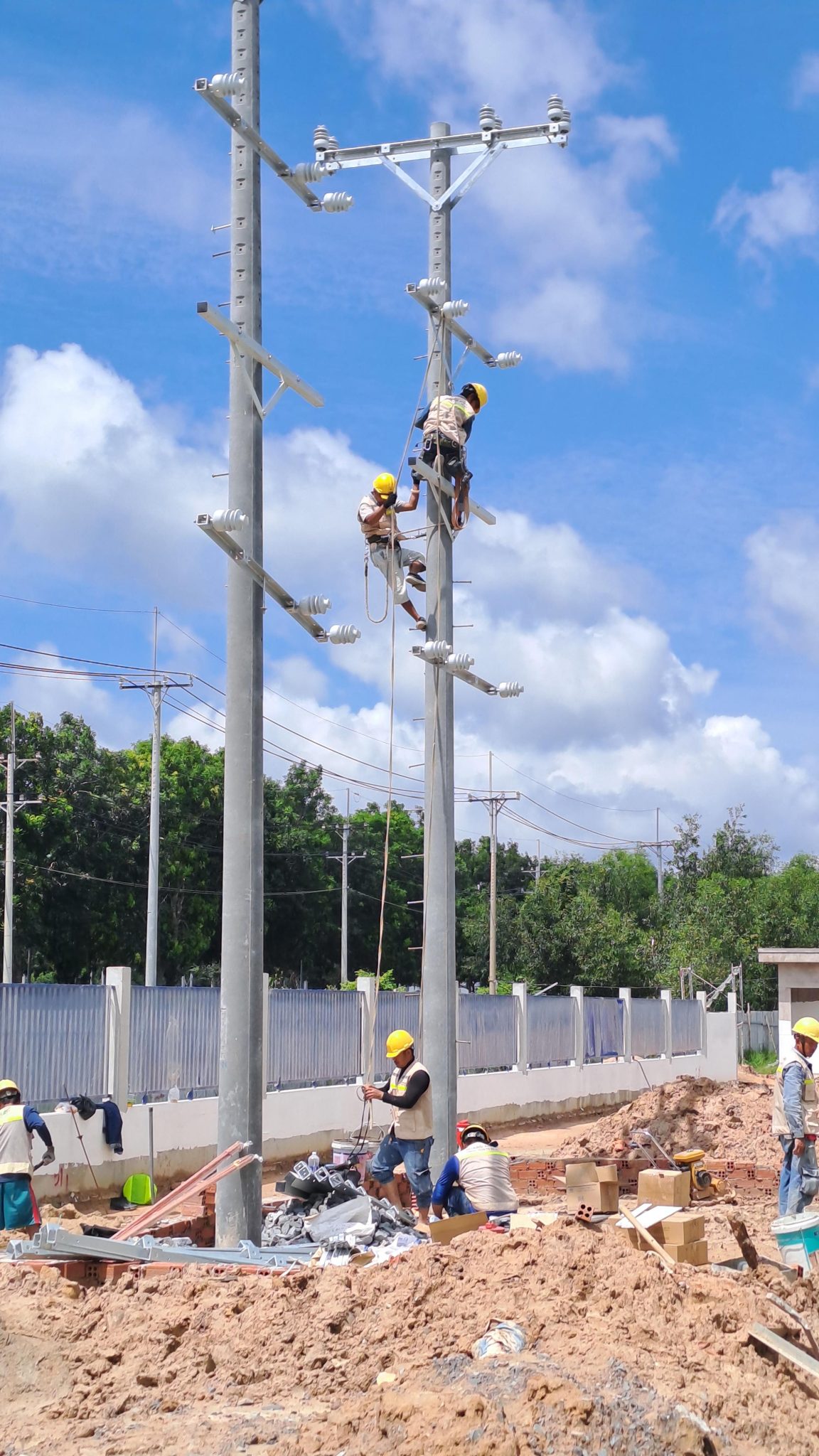 Technical Requirements in Industrial Electrical Systems Engineers reviewing safety protocols for electrical systems.