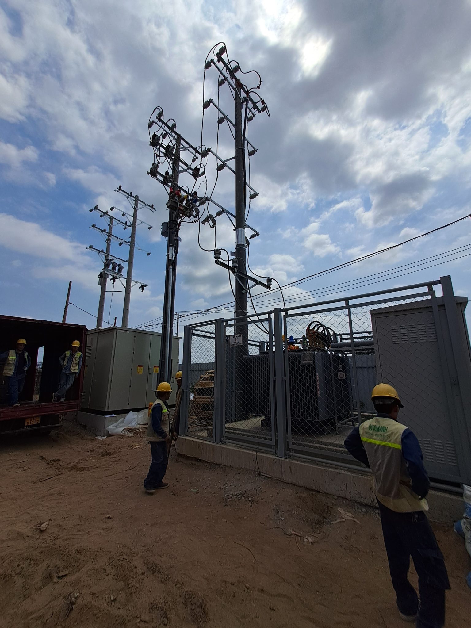 Ensuring Safety in Electrical System Installation Engineers reviewing safety standards for electrical installation.