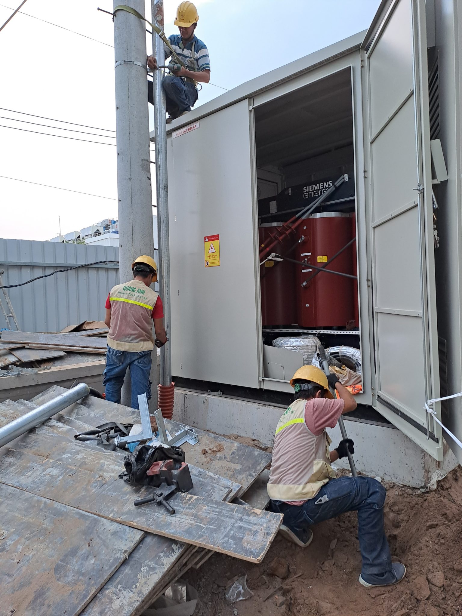 Electrical system testing of transformer station Technician inspecting the electrical system of a transformer station.