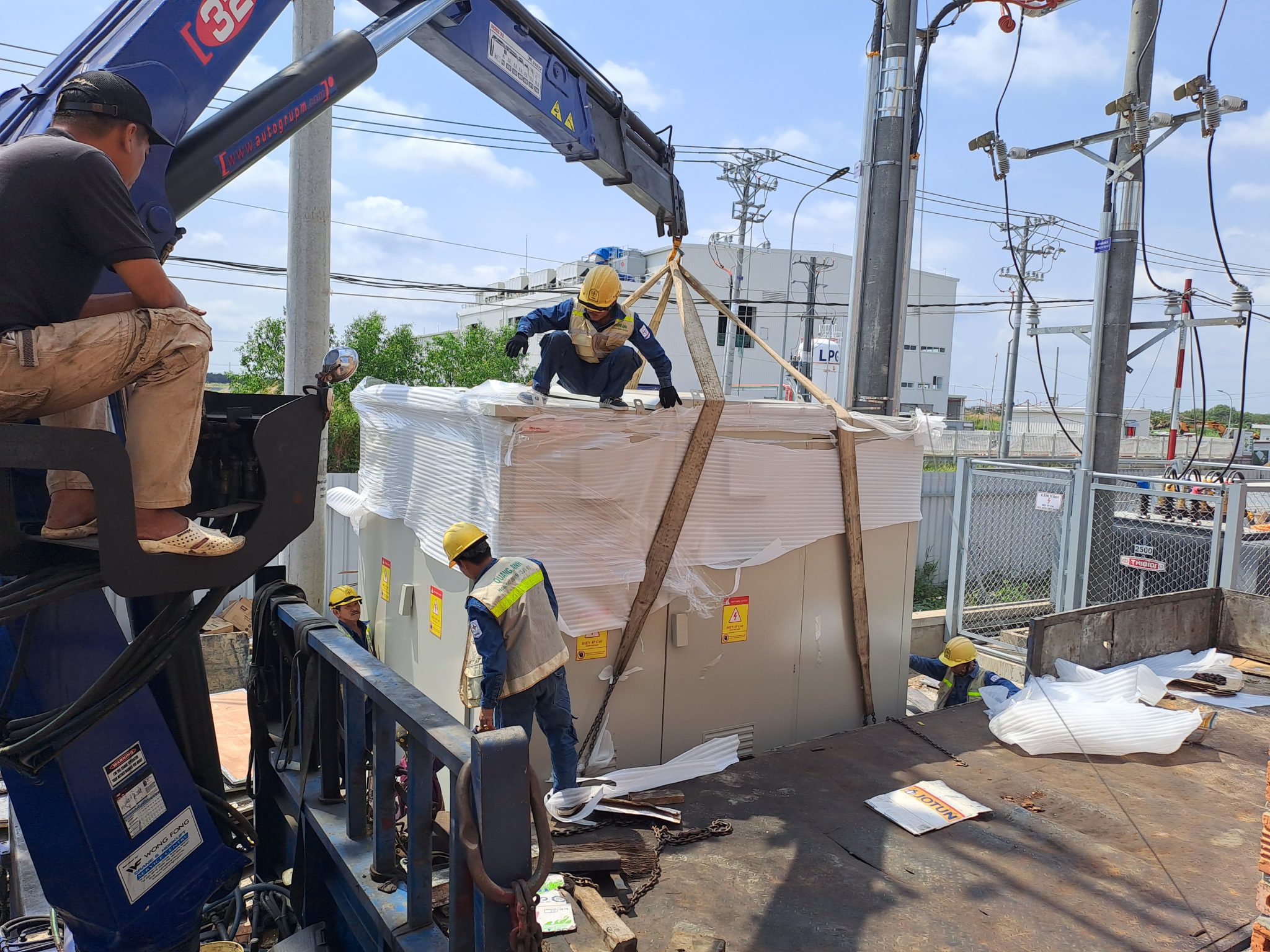 Workers surveying terrain for solar project.